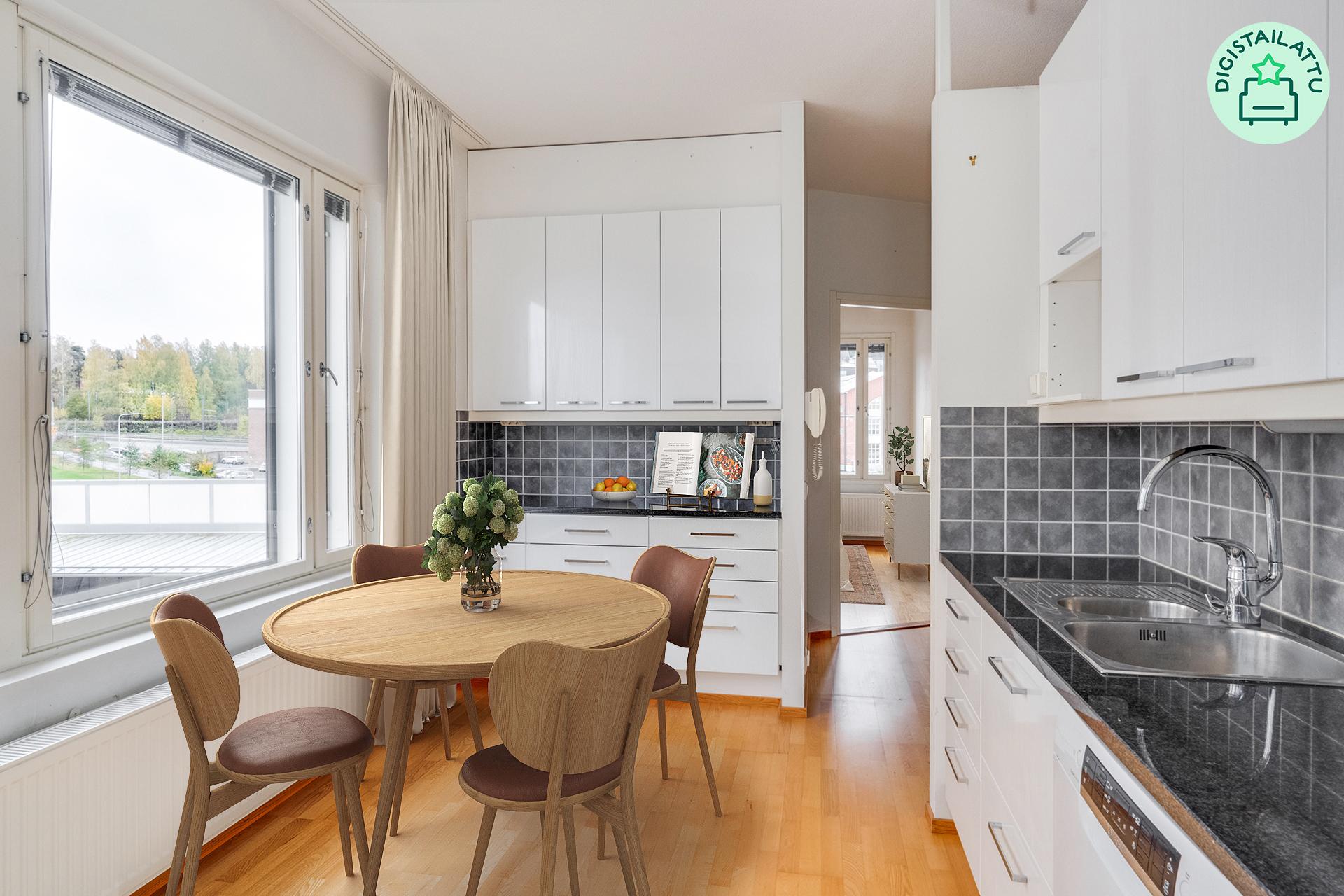 Raikkaassa keittiössä on hyvin kaappi- ja laskutilaa